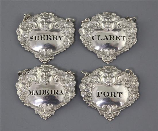 A set of four George III silver wine labels by Charles Rawlings, 56mm.
